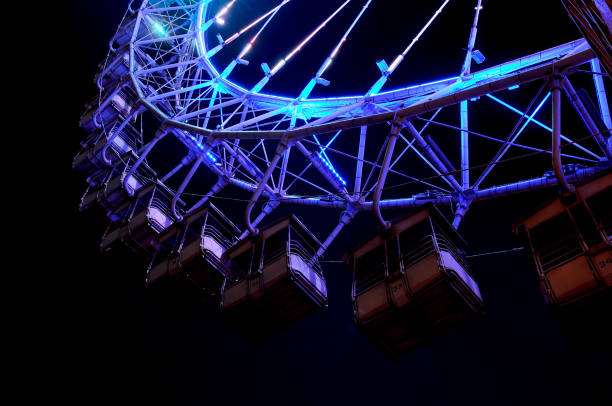 istock Big ferris wheel with festive blue illumination 1011756758