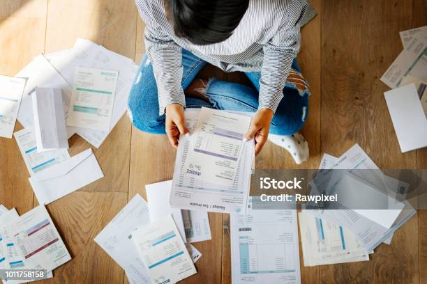 Woman Managing The Debt Stock Photo - Download Image Now - Debt, Financial Bill, Tax