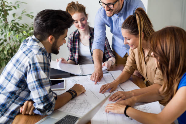 istock Image of business partners discussing documents and ideas 1011771428