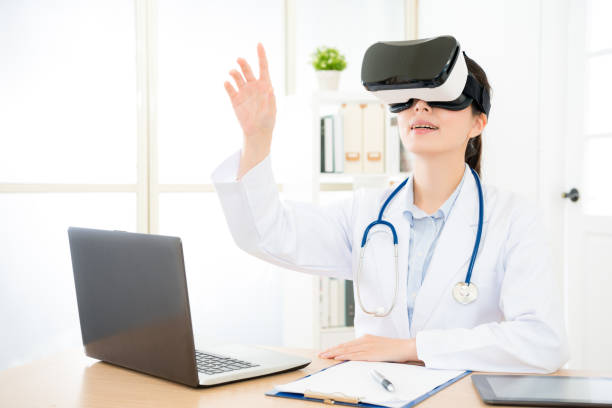 istock happy doctor woman wearing virtual reality goggles 1011771608