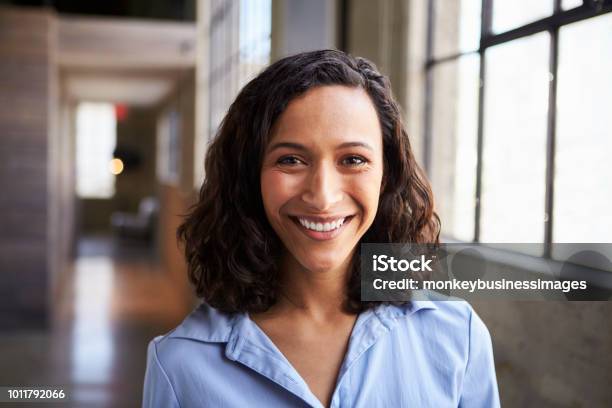 Young Mixed Race Businesswoman Smiling To Camera Stock Photo - Download Image Now - Women, One Woman Only, Portrait