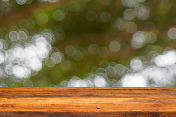 istock Empty wood Shelf on green bokeh background 1011792490