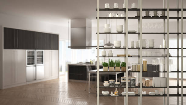 istock Kitchen living room shelving system foreground close-up, interior design concept, white modern room open plan in the background 1011792592