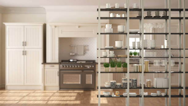 istock Kitchen living room shelving system foreground close-up, interior design concept, white modern room open plan in the background 1011792638
