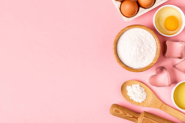 istock Ingredients and utensils for baking on a pastel background 1011796722