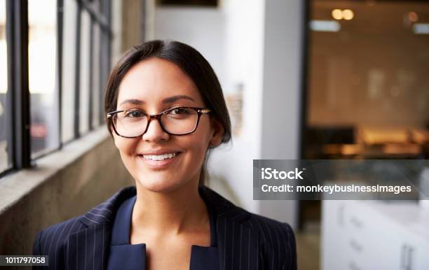 Young Mixed Race Businesswoman Wearing Glasses Close Up Stock Photo - Download Image Now