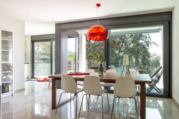 istock Dining room detail with design table and chairs in modern apartment 1011808994