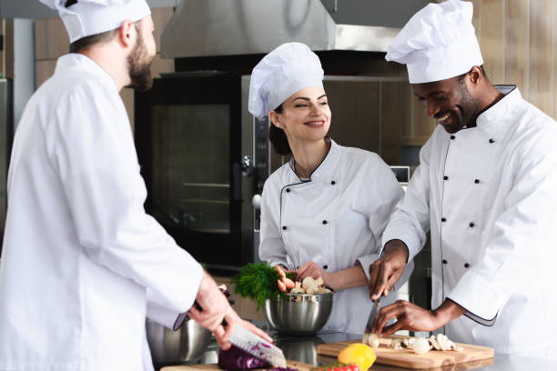 istock Multiracial team of cooks working together in restaurant kitchen 1011813000