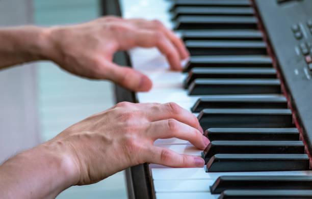 istock Playing piano close up photo 1011813388