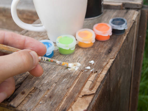 istock trying colors with paint brush 1011819338