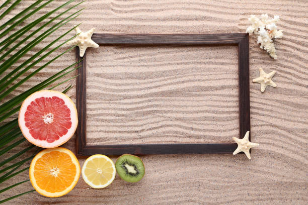 Pineapple and exotic fruits on the plate of leaves