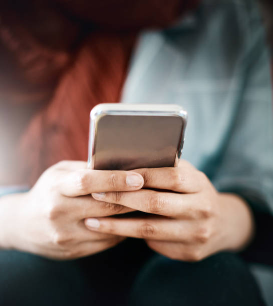 istock Woman's hands busy texting on mobile phone 1011823760