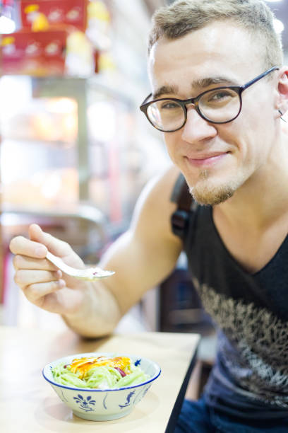 istock Tourist eating cendol dessert 1011833838