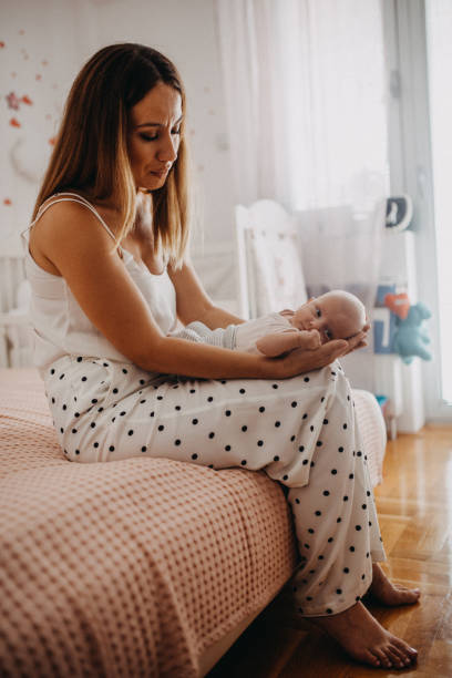 istock Mother holding her baby 1011835126