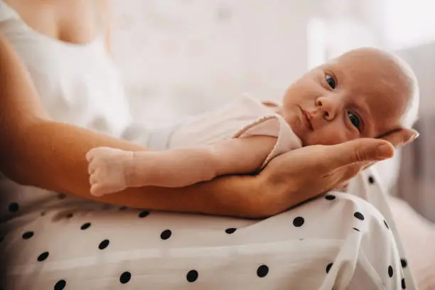 Photo of Mother holding her baby