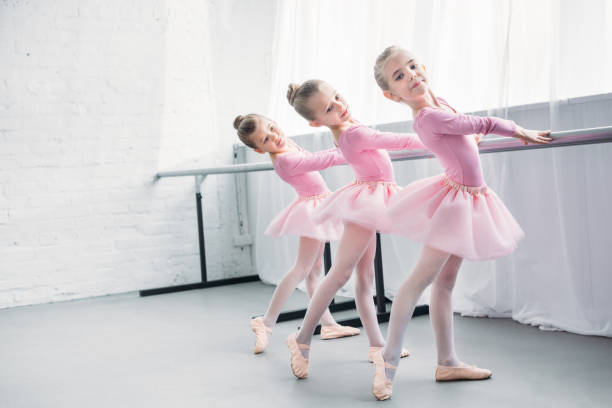 istock graceful elegant little ballerinas practicing together in ballet studio 1011838874