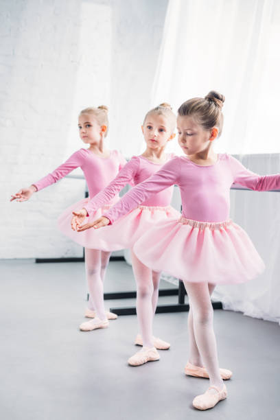 istock adorable little ballerinas practicing together in ballet studio 1011838918