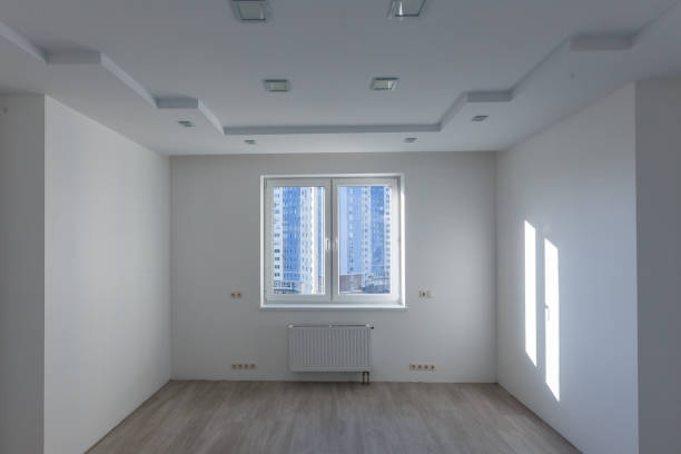 istock Blank white wall with window and concrete floor mock up d render 1011845494