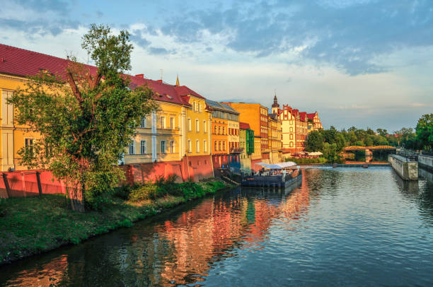 istock Landscape, old buildings under the river, sunset 1011848978