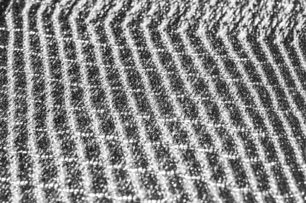 istock Texture, background, pattern. Women's scarf, striped fabric Black white lines intertwined 1011853384