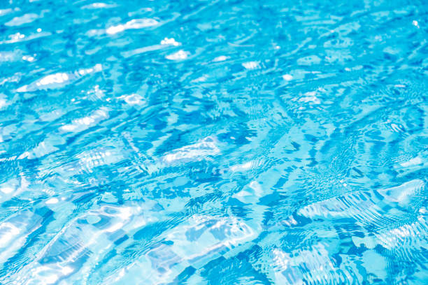 istock Water in swimming pool texture background 1011860412