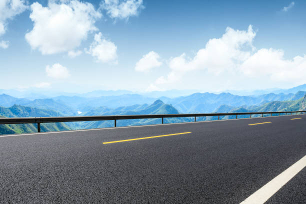 istock Empty asphalt road and beautiful mountain scenery 1011864262