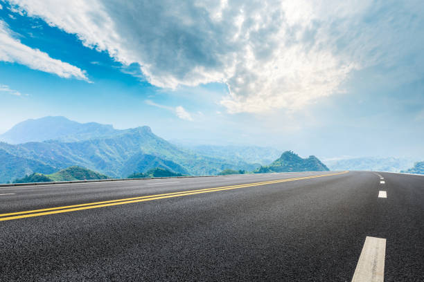 istock Empty asphalt road and beautiful mountain scenery 1011864764
