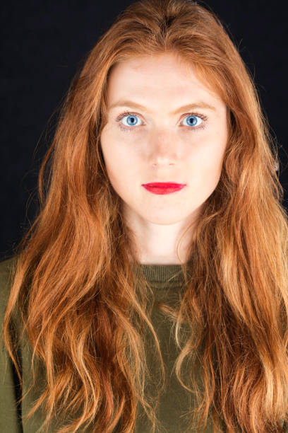 istock Portrait of a redhead with blue eyes 1011867658