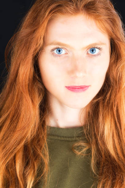 istock Portrait of a redhead with blue eyes 1011868076