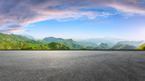 istock Empty asphalt square car tire brakes and mountain scenery 1011870918