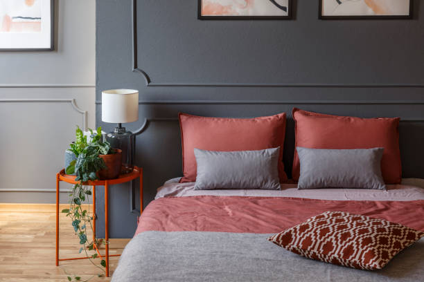 istock Pink and grey hotel bedroom 1011876334