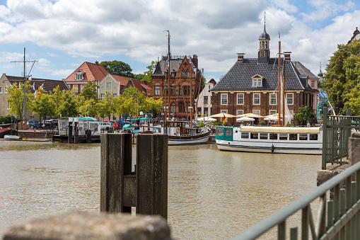 The River Amstel with Magere Brug city bridge on a summer day in Amsterdam, The Netherlands