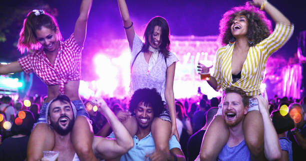 istock Friends dancing at a concert. 1011883722
