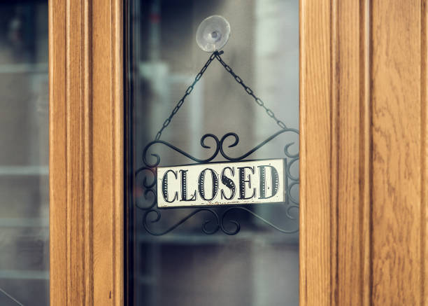 istock Closed vintage hanging sign 1011887182