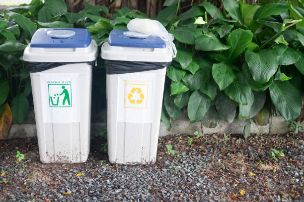 istock White bins for general waste and recycling in the park 1011904854