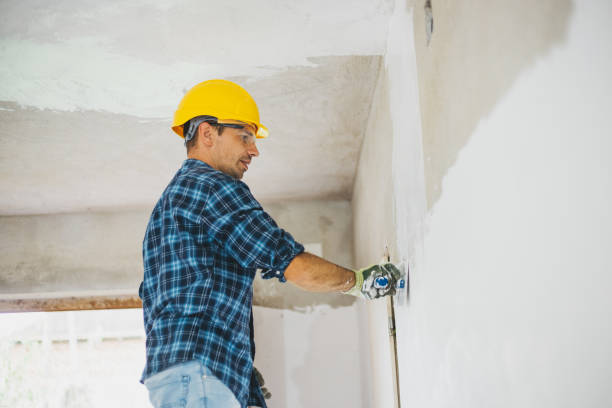 istock Young man finishing a drywall at home 1011905190
