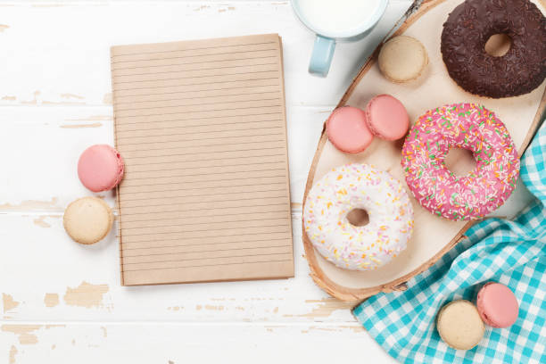 istock Milk and donuts on wooden table 1011906214