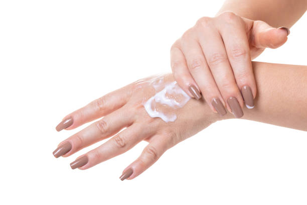 istock female hands in cosmetic cream 1011911892