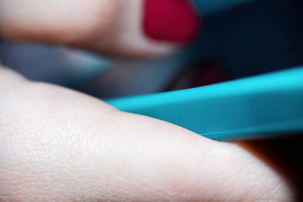 istock Close-Up Of Female Hand Using Smartphone And Writing Text Messages 1011915032