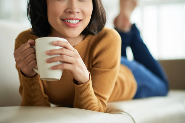 istock Young woman drinking coffee 1011915504
