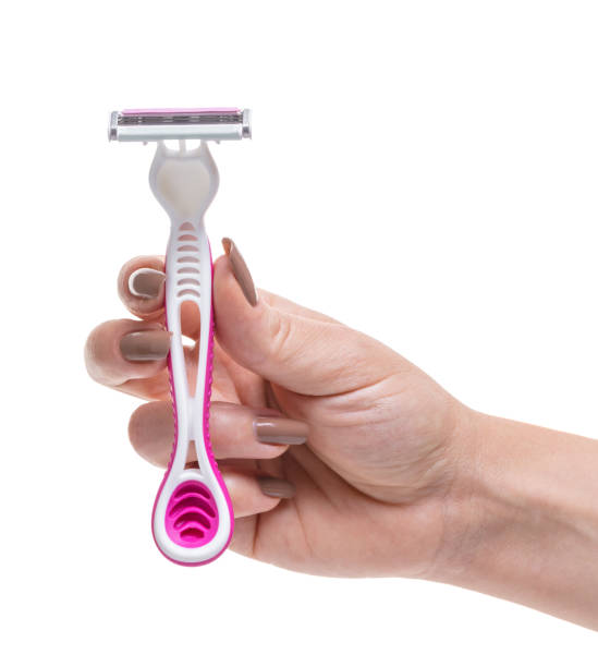 istock razor in a female hand 1011916252