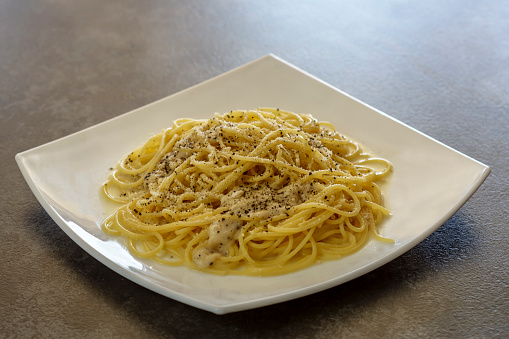 Spaghetti Pasta Cacio e Pepe (Cheese and Pepper). Typical Roman Cuisine