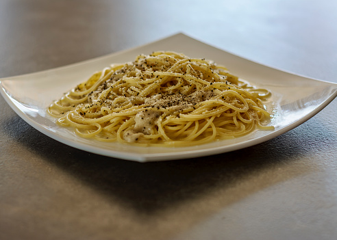 Spaghetti Pasta Cacio e Pepe (Cheese and Pepper). Typical Roman Cuisine