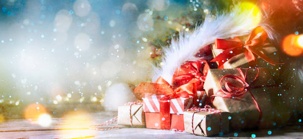 istock Christmas and New Year background with snow and light bokeh 1011918908