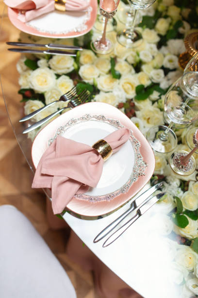 istock Elegant wedding table arrangement, floral decoration, restaurant. Wedding table setup 1011920572