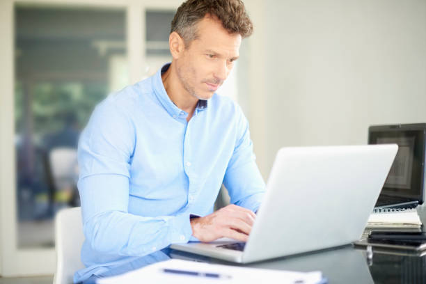 istock Businessman working on laptop at the office 1011923474