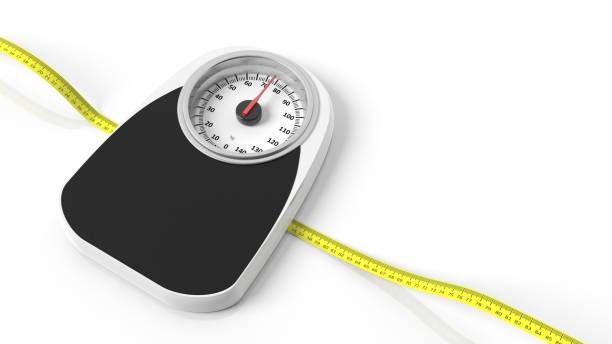istock Bathroom scale with measuring tape, isolated on white background. 1011924388