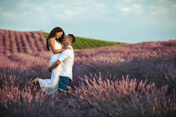 istock Embraced couple in lavender field 1011924778