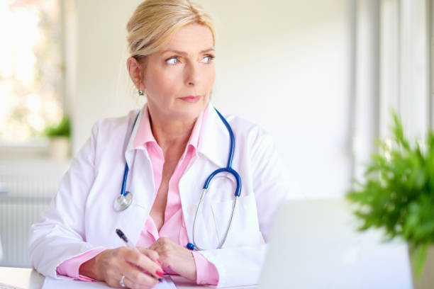 istock Overworked senior female doctor 1011924844