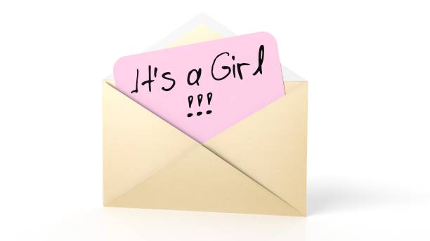 istock Open yellow envelope with It's a Girl note, isolated on white. 1011925296